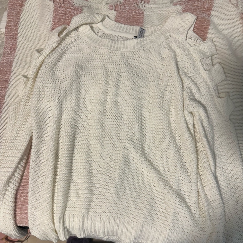 White sweater.